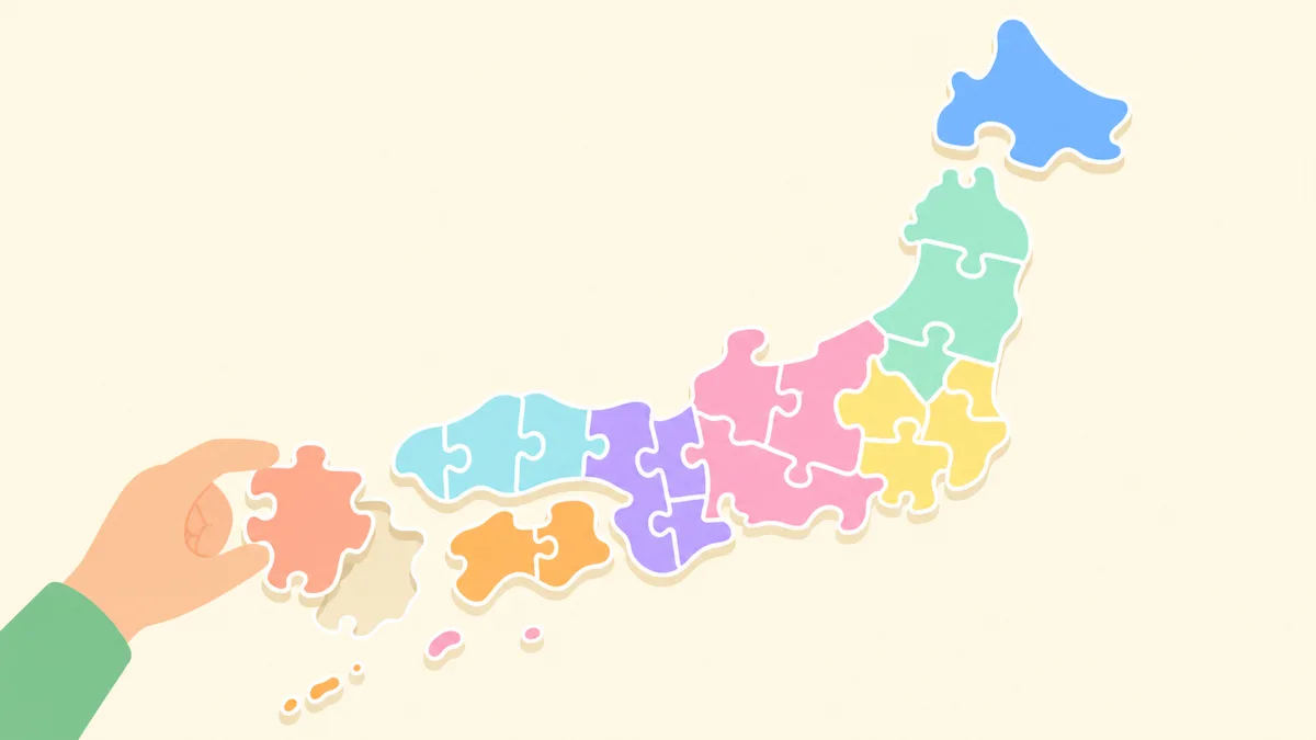 8地方ごとに色分けされた日本地図のジグソーパズルを組み立てるフラットイラスト